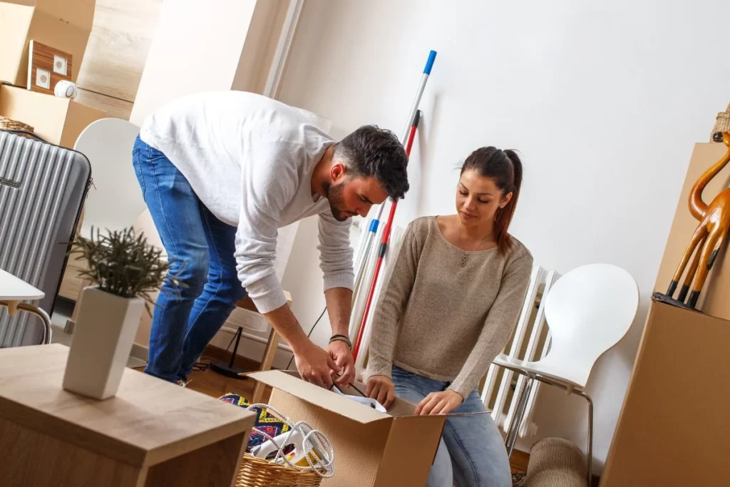 Couple-unpacking-boxes-in-a-likely-newly-cleaned-apartment
