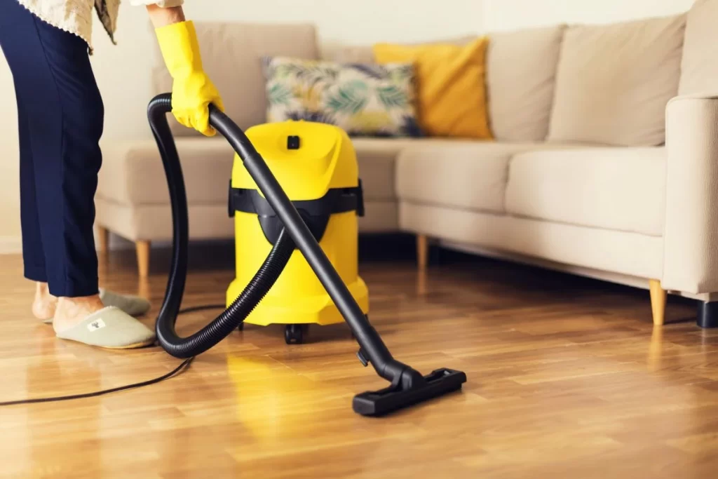 Vacuum-cleaner-being-used-on-a-wooden-floor-during-a-one-time-cleaning