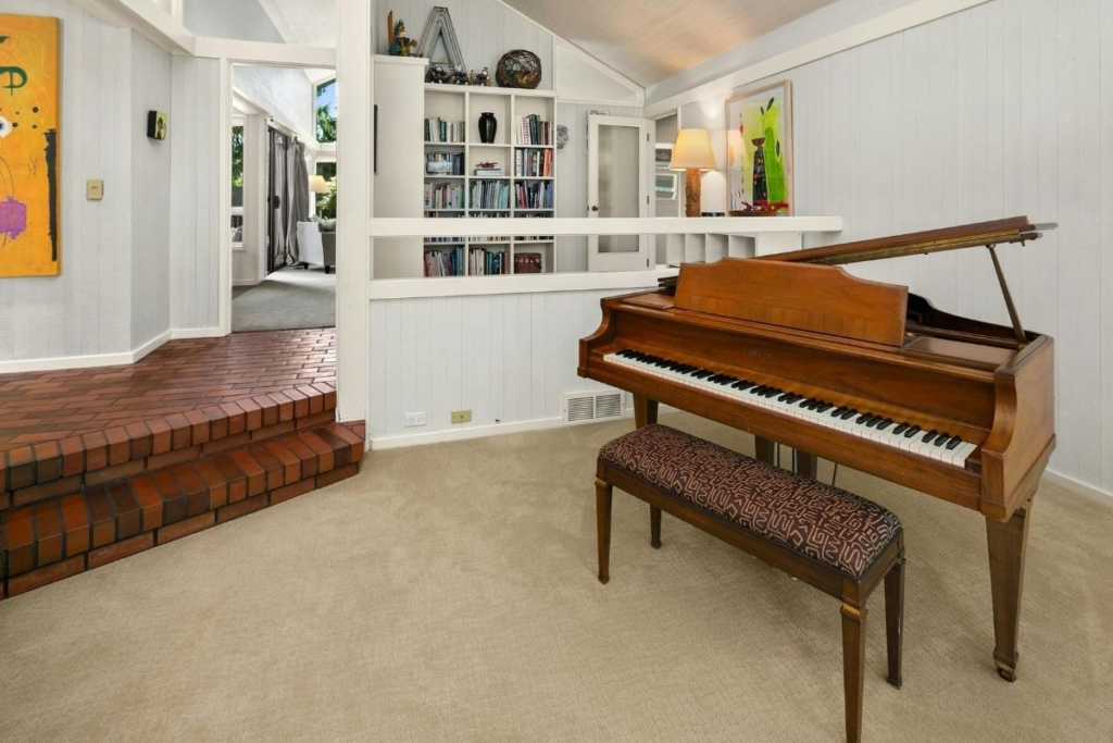 Polished piano and clean carpets; a reminder that deep cleaning improves indoor air quality in living areas.