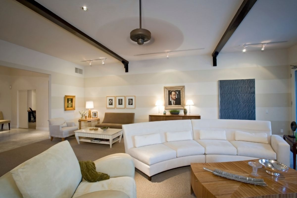 Luxury white living room and seating area cleaned with sustainable eco-cleaning services for a pristine finish.